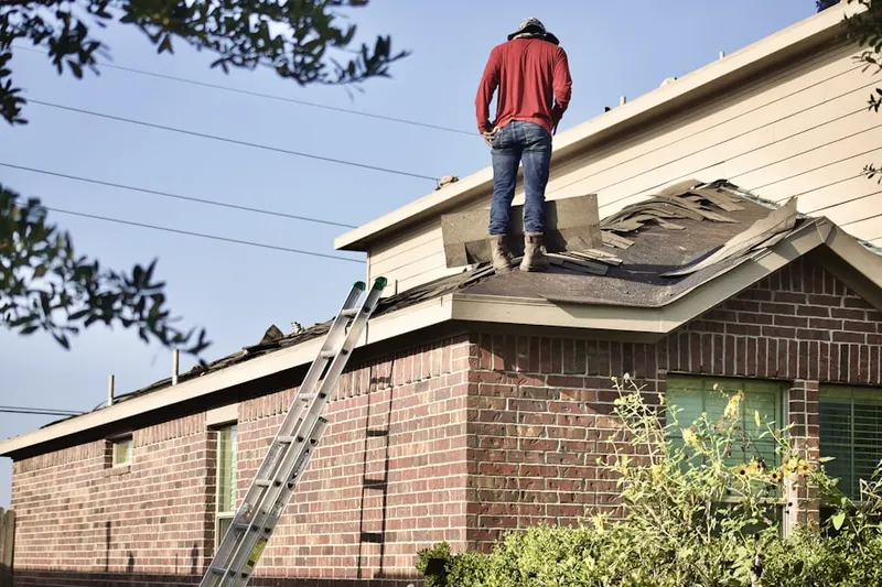 Professional roofer working on a residential roof in Ridgefield Park village